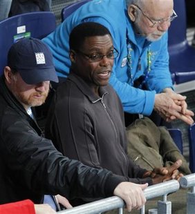 Former U.S. Olympic athlete Carl Lewis (C) watches the men's round robin curling game at the Vancouver 2010 Winter Olympics February 21, 2010. REUTERS/Lyle Stafford
Former U.S. Olympic athlete Carl Lewis (C) watches the men's round robin curling game at the Vancouver 2010 Winter Olympics February 21, 2010. REUTERS/Lyle Stafford