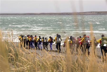 Teams battle high winds on the beach on the Chilean side of Tierra del Fuego island as the 2010 Wenger Patagonian Expedition Race gets underway with a 16km trek February 9, 2010. REUTERS/Will Gray
Teams battle high winds on the beach on the Chilean side of Tierra del Fuego island as the 2010 Wenger Patagonian Expedition Race gets underway with a 16km trek February 9, 2010. REUTERS/Will Gray