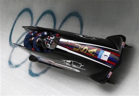Pilot Steven Holcomb, Justin Olsen, Steve Mesler and Curtis Tomasevicz of team USA 1 speed down the track during heat 3 of the four-man bobsleigh competition at the Vancouver 2010 Winter Olympics in Whistler, British Columbia, February 27, 2010. REUTERS/Pawel Kopczynski
Pilot Steven Holcomb, Justin Olsen, Steve Mesler and Curtis Tomasevicz of team USA 1 speed down the track during heat 3 of the four-man bobsleigh competition at the Vancouver 2010 Winter Olympics in Whistler, British Columbia, February 27, 2010. REUTERS/Pawel Kopczynski