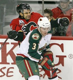 Calgary Flames forward Nigel Dawes (L) gets hit by Minnesota Wild defencemen Marek Zidlicky (3) during the first period of their NHL hockey game in Calgary, Alberta December 11, 2009 file photo. REUTERS/Todd Korol
Calgary Flames forward Nigel Dawes (L) gets hit by Minnesota Wild defencemen Marek Zidlicky (3) during the first period of their NHL hockey game in Calgary, Alberta December 11, 2009 file photo. REUTERS/Todd Korol