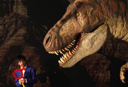 
A host talks in front of a Tyrannosaurus rex replica display named Kokoro during a media preview of the "Playing with Dinosaurs" exhibition at the National Chiang Kai-Shek Memorial Hall in Taipei December 7, 2009 file photo. REUTERS/Nicky Loh
