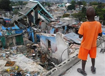 
A boy looks at the ruins of his Fort National neighborhood in Port-au-Prince March 4, 2010. The neighborhood is one of the worst hit by the January 12 quake that killed 300,000 people, according to government estimates. Picture taken March 4, 2010. REUTERS/Matthew Bigg
