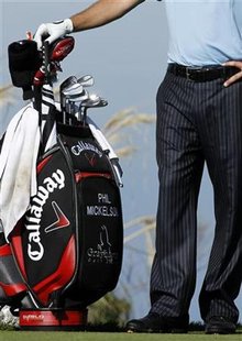 
U.S. golfer Phil Mickelson stands by his bag of golf clubs on the second tee during third round play at PGA's San Diego Open in San Diego, California, January 30, 2010. Mickelson is playing with a controversial 20-year old Ping wedge. REUTERS/Mike Blake

