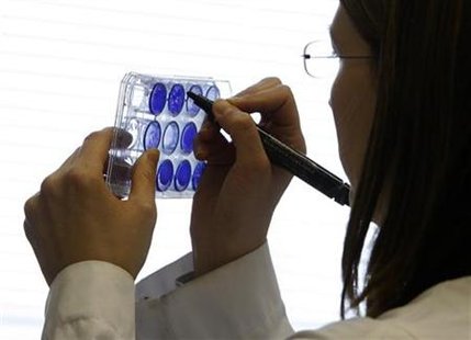 
A researcher works in a laboratory at the National Institute for Medical Research in London April 27, 2009. REUTERS/Luke MacGregor

