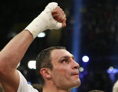 
WBC heavyweight champion boxer Vitali Klitschko of Ukraine reacts after winning against contender Kevin Johnson of the U.S. after their 12-round WBC heavyweight title fight in Bern December 12, 2009. REUTERS/Michael Buholzer

