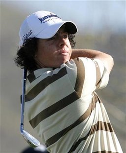 
Rory McIlroy of Northern Ireland watches his tee shot on the third hole during the second round of the WGC-Accenture Match Play Championship golf tournament in Marana, Arizona February 18, 2010. REUTERS/Matt Sullivan
