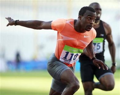 
Ivory Williams of the U.S. crosses the finish line in the men's 100 meters final during the IAAF Athens Grand Prix Tsiklitiria 2009 at the Olympic Stadium in this file photo taken July 13, 2009. REUTERS/John Kolesidis/Files
