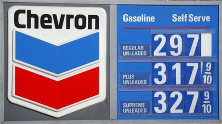 
The Chevron corporate logo and the current price of unleaded fuel per gallon are shown at a Washington DC gas station January 11, 2010. REUTERS/Jason Reed

