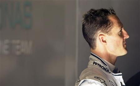
Mercedes GP Formula One driver Michael Schumacher of Germany looks at a screen during a training session at the Montmelo racetrack, near Barcelona, February 28, 2010. REUTERS/ Albert Gea
