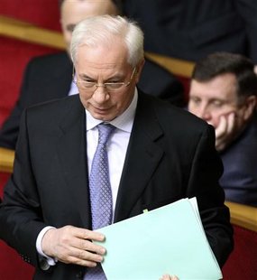 
Ukraine's former finance minister Mykola Azarov stands during the parliament session in Kiev March 11, 2010. REUTERS/Konstantin Chernichkin
