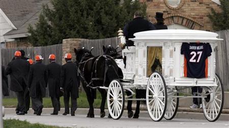 
A horse-drawn hearse leaves the Great Commission Baptist Church after the funeral services for deceased NFL football player Darrent Williams in Fort Worth, Texas January 6, 2007 file photo. REUTERS/Mike Stone
