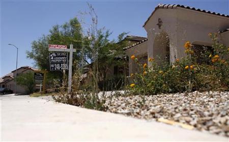 
Real estate signs are seen in the front yards of houses for sale in this file photo taken in Maricopa, Arizona, May 27, 2009. REUTERS/Joshua Lott/Files
