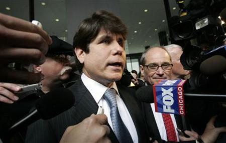 
Former Illinois Governor Rod Blagojevich (L) speaks to the media as his attorney Sheldon Sorosky looks on as they leave the Dirksen federal building after his arraignment hearing in Chicago, Illinois April 14, 2009. REUTERS/Frank Polich
