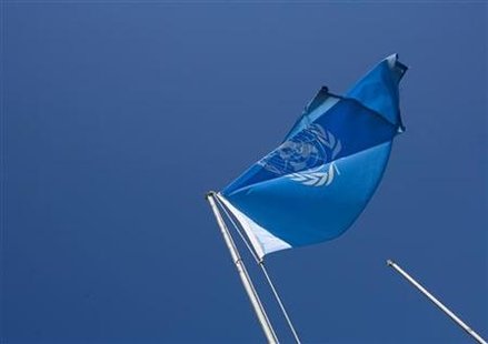 
A United Nations flag is raised at the United Nations multi-agency compound near Herat in this November 5, 2009 file photo. REUTERS/Morteza Nikoubazl

