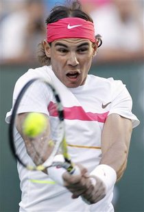 
Rafael Nadal of Spain returns a shot against Rainer Schuettler of Germany during their match at the Indian Wells ATP tennis tournament in Indian Wells, California, March 13, 2010. REUTERS/Danny Moloshok
