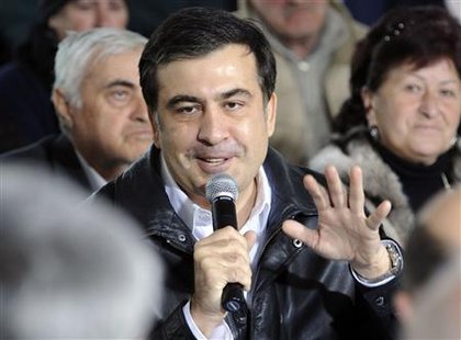
Georgia's President Mikheil Saakashvili (C) meets with residents of Rachisubani settlement, some 50 km (31 miles) south-west of the capital Tbilisi March 14, 2010. REUTERS/Irakli Gedenidze/Pool
