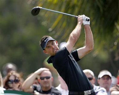 
South Africa's Charl Schwartzel tees off on the third hole during final round play of the WGC-CA Championship at TPC at Doral in Miami, Florida, March 14, 2010. REUTERS/Hans Deryk
