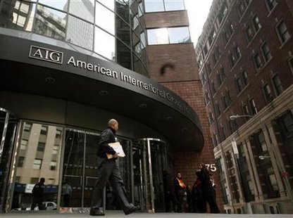 
A man walks past the American International Group (AIG) building in New York's financial district, March 16, 2009. REUTERS/Brendan McDermid
