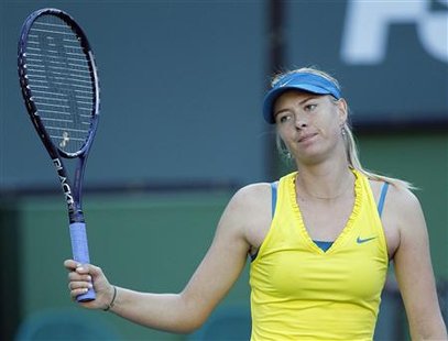 
Maria Sharapova of Russia reacts after losing a point against Zheng Jie of China during their match at the Indian Wells WTA tennis tournament in Indian Wells, California, March 14, 2010. REUTERS/Danny Moloshok
