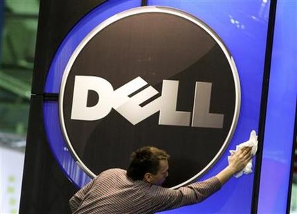 
A man wipes the logo of the Dell IT firm at the CeBIT exhibition centre in Hannover February 28, 2010. The world's largest IT fair CeBIT opens its doors on March 2 and runs through March 6. REUTERS/Thomas Peter
