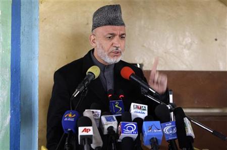
Afghan President Hamid Karzai addresses locals in Marjah March 7, 2010. REUTERS/Dusan Vranic/Pool
