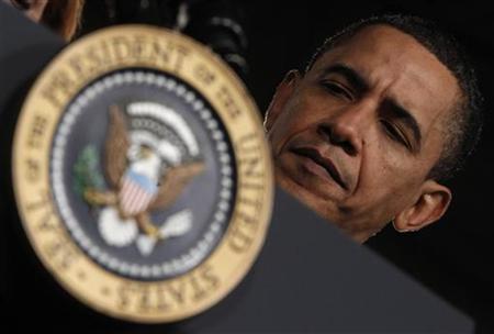 
President Barack Obama listens to his introduction as he arrives to deliver remarks on health insurance reform at Walter F. Ehrnfelt Recreation and Senior Center in Strongsville, Ohio, March 15, 2010. REUTERS/Jim Young
