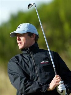 English actor Hugh Grant watches his tee shot during the first round of the Dunhill Links Championship at the Kingsbarns course in Fife, Scotland, October 7, 2004. REUTERS/Darren Staples
English actor Hugh Grant watches his tee shot during the first round of the Dunhill Links Championship at the Kingsbarns course in Fife, Scotland, October 7, 2004. REUTERS/Darren Staples