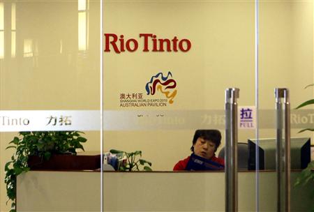 
A receptionist checks an express mail at the Rio Tinto Limited Beijing Representative Office in Beijing March 19, 2010. REUTERS/Jason Lee
