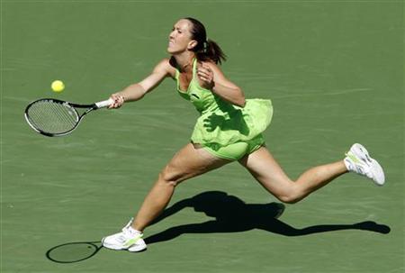 
Jelena Jankovic of Serbia hits a return to Samantha Stosur of Australia during their semi-final match at the Indian Wells WTA tennis tournament in Indian Wells, California, March 19, 2010. REUTERS/Kevin Lamarque
