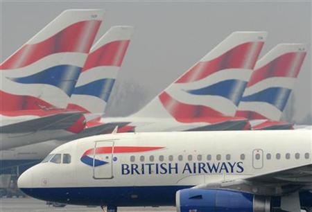 
A British Airways (BA) passenger jet taxis near stationary BA planes at Heathrow Airport in west London March 19, 2010. REUTERS/Toby Melville
