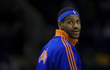 
Cleveland Cavaliers forward LeBron James warms up with his team in this February 19, 2010 file photo. REUTERS/Chris Keane
