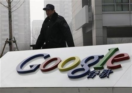 
A man walks past the Google logo in front of its China headquarters building in Beijing March 19, 2010. REUTERS/Jason Lee
