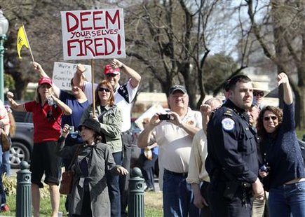 
Protesters are pictured in the area where U.S. President Barack Obama will meet with members of the House Democratic Caucus to discuss the health care package in the Capitol Visitors Center Auditorium on Capitol Hill in Washington, March 20, 2010. REUTERS/Larry Downing
