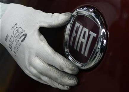A worker adjusts the logo on a new Fiat Punto at a Fiat factory assembly line in the central Serbian town of Kragujevac, some 120 km (75 miles) south of Belgrade, March 18, 2010. REUTERS/Ivan Milutinovic
A worker adjusts the logo on a new Fiat Punto at a Fiat factory assembly line in the central Serbian town of Kragujevac, some 120 km (75 miles) south of Belgrade, March 18, 2010. REUTERS/Ivan Milutinovic