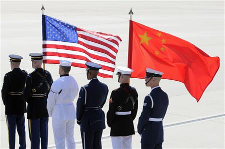
A color guard of U.S. and Chinese flags awaits President of China Hu Jintao's plane as he arrives in advance of his participation in the nuclear security summit in Washington, at Andrews Air Force Base, Maryland, April 12, 2010. REUTERS/Jonathan Ernst

