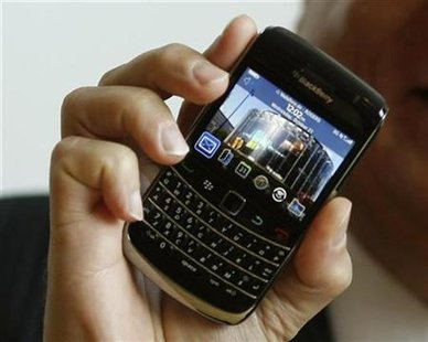 




Mike Lazaridis, President and Co-CEO of Research In Motion (RIM), poses with the new "Blackberry Bold 9700" handset during its launch in Bochum October 21, 2009. REUTERS/Ina Fassbender

