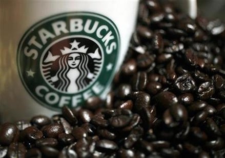 A mug bearing a Starbucks logo is pictured next to coffee beans during a news conference in Tokyo April 13, 2010. REUTERS/Yuriko Nakao
A mug bearing a Starbucks logo is pictured next to coffee beans during a news conference in Tokyo April 13, 2010. REUTERS/Yuriko Nakao