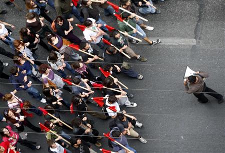 
Members of the communist's labour union (PAME) take part in a protest march in Athens April 21, 2010. REUTERS/John Kolesidis
