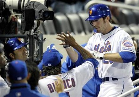 New York Mets batter Ike Davis (R) is congratulated at the dugout steps by teammates after he hit a home run against the Atlanta Braves in the fifth inning of their National League baseball game in New York April 23, 2010. REUTERS/Ray Stubblebine
New York Mets batter Ike Davis (R) is congratulated at the dugout steps by teammates after he hit a home run against the Atlanta Braves in the fifth inning of their National League baseball game in New York April 23, 2010. REUTERS/Ray Stubblebine