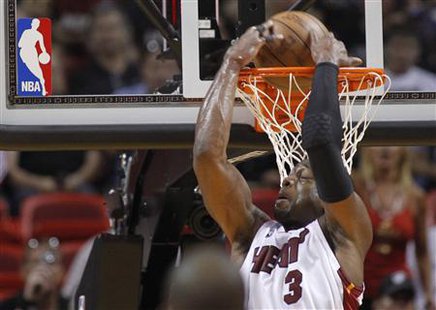 Miami Heat's Dwyane Wade dunks behind his back in the first quarter of play against the Boston Celtics during Game 4 of their Eastern Conference NBA playoff series in Miami, April 25, 2010. REUTERS/Joe Skipper
Miami Heat's Dwyane Wade dunks behind his back in the first quarter of play against the Boston Celtics during Game 4 of their Eastern Conference NBA playoff series in Miami, April 25, 2010. REUTERS/Joe Skipper
