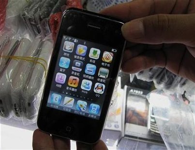 
A counterfeit Apple iPhone, which sold for RMB450 ($66), is shown at a mall selling electronics in the southern Chinese city of Shenzhen in Guangdong province July 30, 2009 file photo. REUTERS/Stringer
