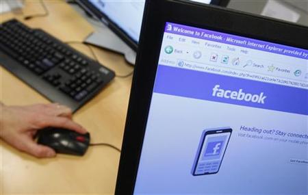 
A Facebook page is displayed on a computer screen. REUTERS/Thierry Roge
