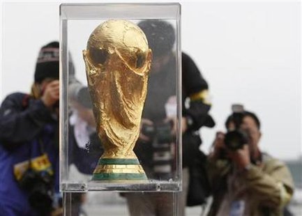 World Cup Of Hockey Trophy. Photographers take pictures of the FIFA World Cup trophy upon its arrival at