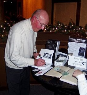 World War Two survivor Gunther Skaletz signs a copy of his book "Life on Both Sides of the Wall" World War Two survivor Gunther Skaletz signs a copy of his book "Life on Both Sides of the Wall"