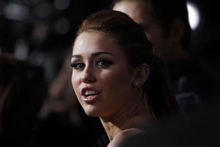 Cast member Miley Cyrus attends the premiere of "The Last Song" at the Arclight theatre in Hollywood, California March 25, 2010. The movie opens in the U.S. on March 31. REUTERS/Mario Anzuoni
Cast member Miley Cyrus attends the premiere of "The Last Song" at the Arclight theatre in Hollywood, California March 25, 2010. The movie opens in the U.S. on March 31. REUTERS/Mario Anzuoni