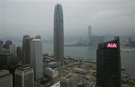 
A panel on top of AIA Central, previously AIG Tower, flashes the company sign at Hong Kong's financial Central district in this February 12, 2010 file photo. REUTERS/Bobby Yip
