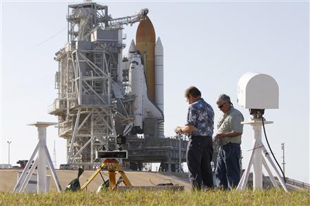 The space shuttle Atlantis is shown atop Launch Pad 39A as photographers prepare for launch at the Kennedy Space Center in Cape Canaveral, Florida May 13, 2010. REUTERS/Scott Audette
The space shuttle Atlantis is shown atop Launch Pad 39A as photographers prepare for launch at the Kennedy Space Center in Cape Canaveral, Florida May 13, 2010. REUTERS/Scott Audette