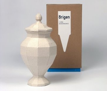 A small canister containing cremated human remains. A small canister containing cremated human remains.