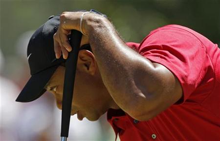 Tiger Woods of the U.S. lines up a putt on the fifth hole during final round play of the Tournament Players Championship PGA golf tournament at TPC Sawgrass in Ponte Vedra Beach, Florida May 9, 2010. REUTERS/Hans Deryk
Tiger Woods of the U.S. lines up a putt on the fifth hole during final round play of the Tournament Players Championship PGA golf tournament at TPC Sawgrass in Ponte Vedra Beach, Florida May 9, 2010. REUTERS/Hans Deryk