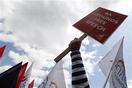 
A striker holds a Unite union banner at a rally in Hyde Park, central London May 28, 2010. REUTERS/Stefan Wermuth
